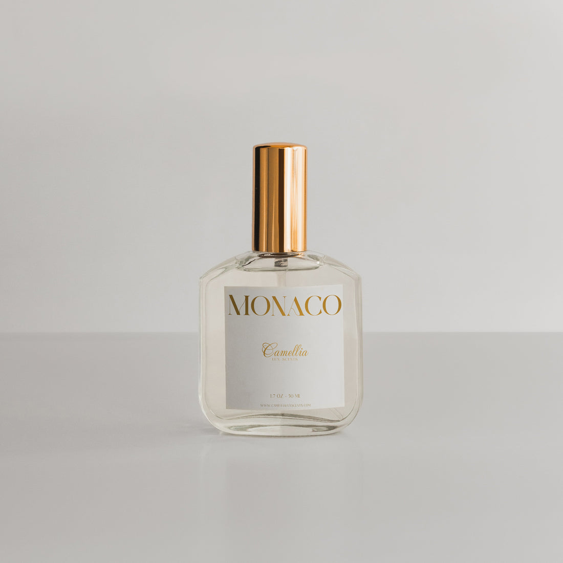 Monaco perfume bottle by Camellia Lux Scents, a luxury-inspired fragrance with warm amber, jasmine, and saffron notes